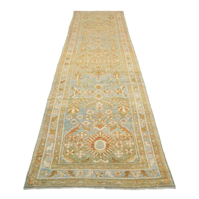 Antique washed out distressed Persian runner rug. Approximately 85-100 years old. In very good condition.