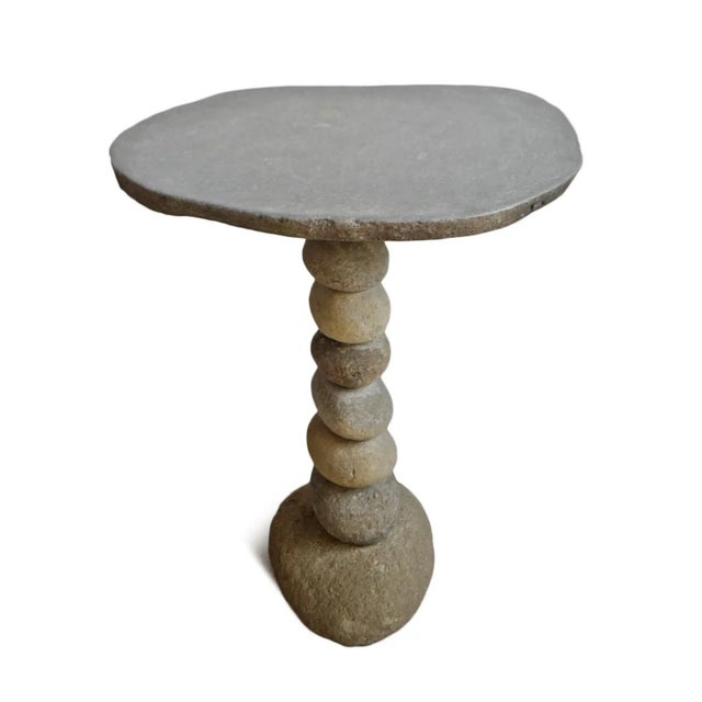 Hand crafted stacked river rock outdoor bistro table. Beautiful organic modern style piece with natural tones and...