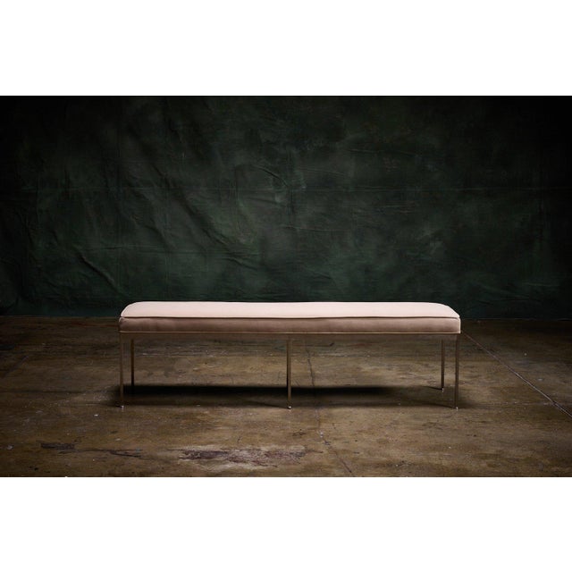 Lawson-Fenning 'Paul' bench with a 60-inch wide blush velvet upholstered seat and a slim metal frame, inspired by mid...
