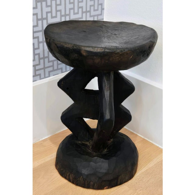Striking vintage Tonga hand carved wood stool, perfect as a sculptural brutalist side table or plant stand on any modern,...