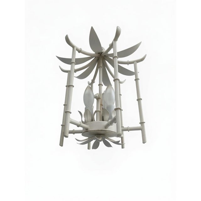 This Vintage Faux Bamboo Pagoda Chandelier Light Fixture is a unique and stylish addition to any coastal or Hollywood...
