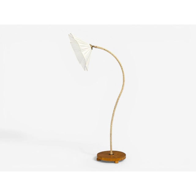 Swedish Mid-Century Modern, Organic Floor Lamp, Cord, Wood, Sweden, 1930s An organic modern floor lamp designed and...
