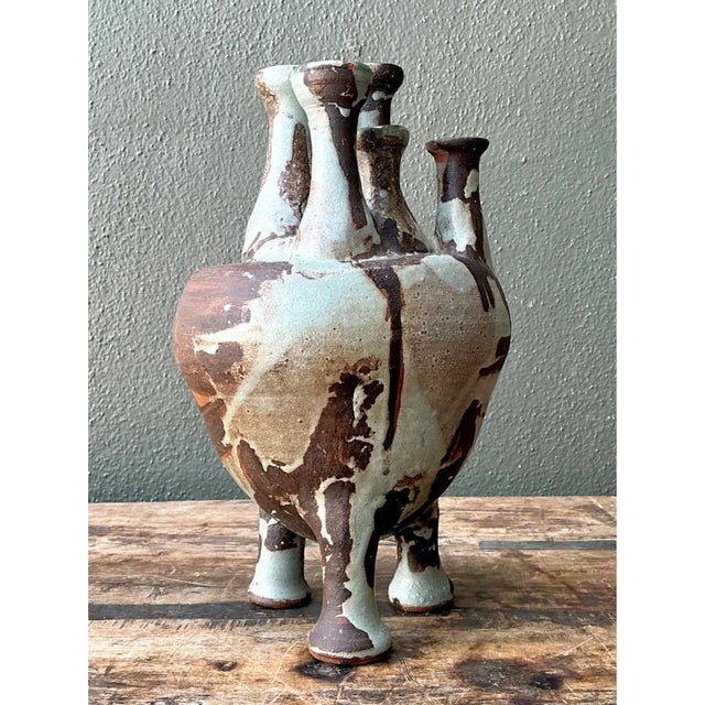 Add an intriguing, handcrafted element to your collection with this unique vintage Mid-Century Modern multineck stoneware...