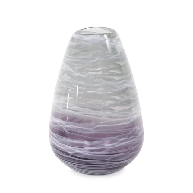 A delicate blend of soft lavender and white hues, with intricate swirling patterns that evoke a sense of movement and...