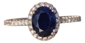 The 77th Avenue: Oval Sapphire and Diamond Halo Ring in White Gold
