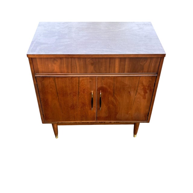 Mid-Century Modern Walnut Bar Cabinet or Record Cabinet on Tapered Legs Clean lines and warm walnut tones define this...