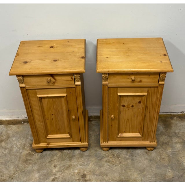 This pair of vintage European pine nightstands captures the enduring charm of 19th century continental design,...