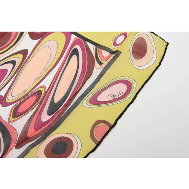 This beautiful array of luscious colors make up this rectangle vintage Italian Emilio Pucci abstract silk scarf. The...