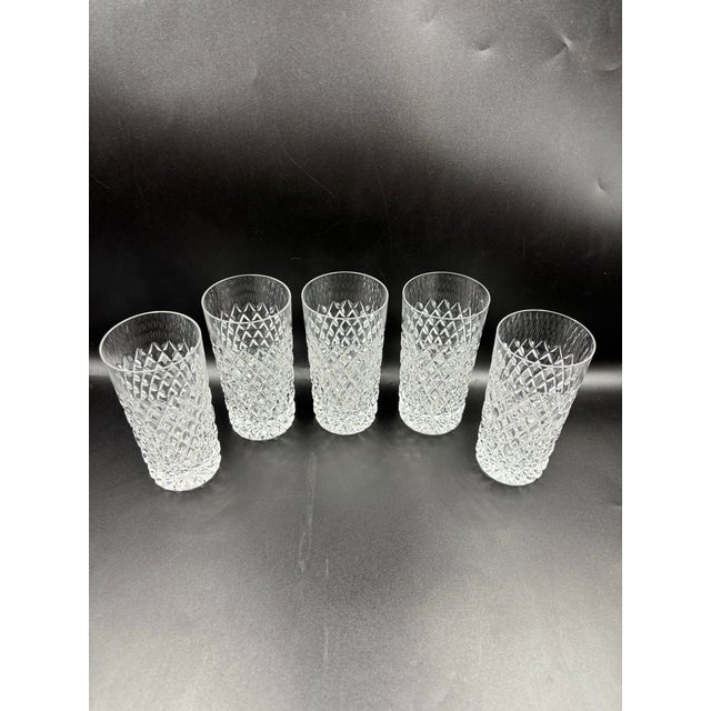 A handsome set of five vintage crystal tumblers featuring an allover diamond-cut pattern that creates beautiful sparkle...