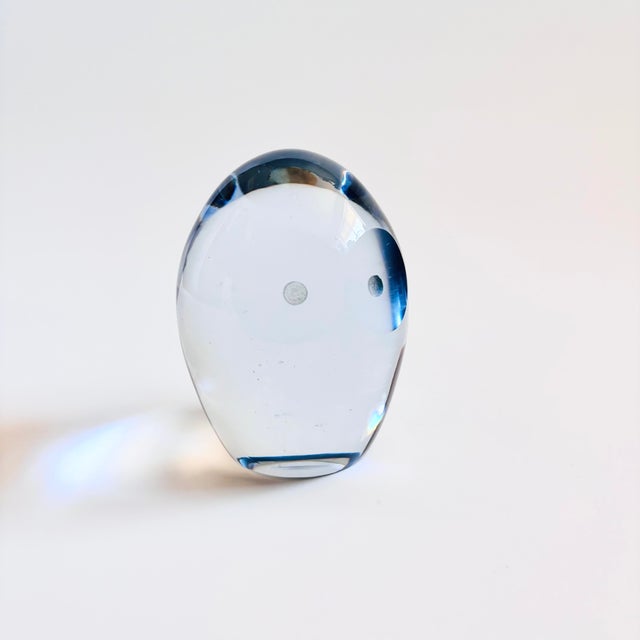 A mid century art glass owl paperweight. Clear color to the glass. Lovely minimalist features to the owl cut into the...