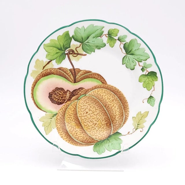 A pair of porcelain dessert plates depicting melons, Germany circa 1860.