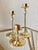 Excellent Pre-Owned Condition. Fabulous prism-like lead crystal orb accented, sleek brass trio of graduated candlesticks...