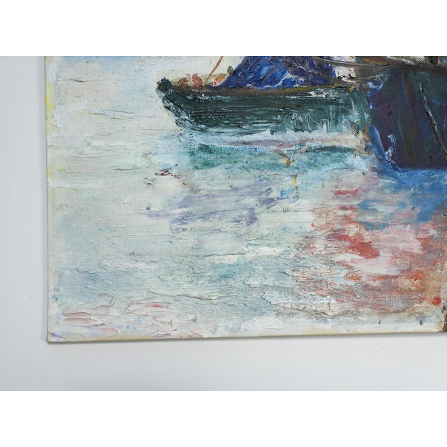 Late 20th century oil on canvas board painting of fishing boats with colorful sails at harbor. Unsigned, areas of heavier...