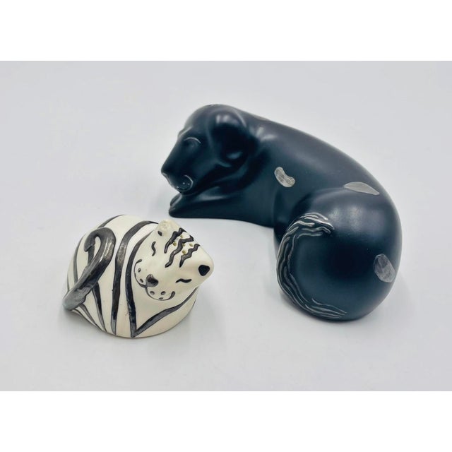 A charming and highly collectible set of dog and cat sculptural figures designed and handcrafted in Taxco, Mexico by...