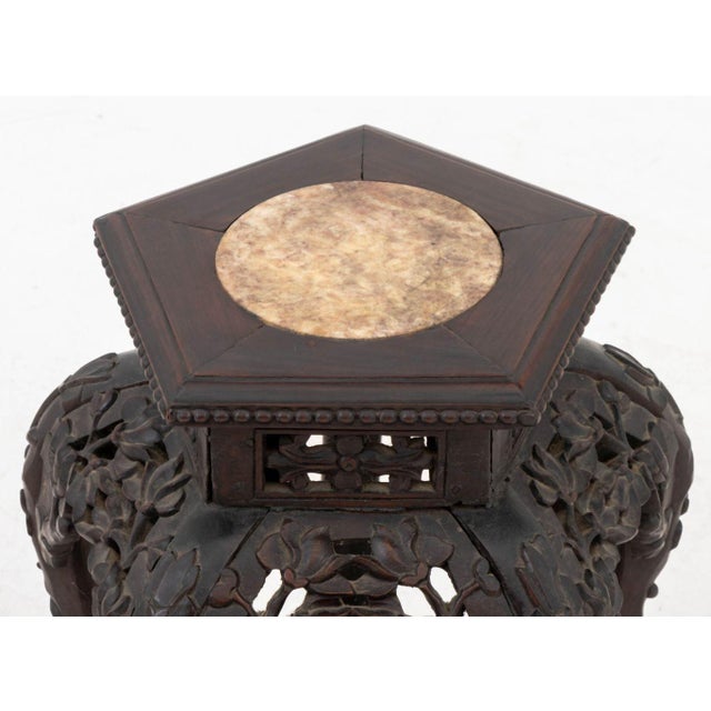 Chinese Red Marble Inset Carved Wood Pedestal Table, pentagonal form with reticulated floral motif apron.&nbsp; 18.5" H x...