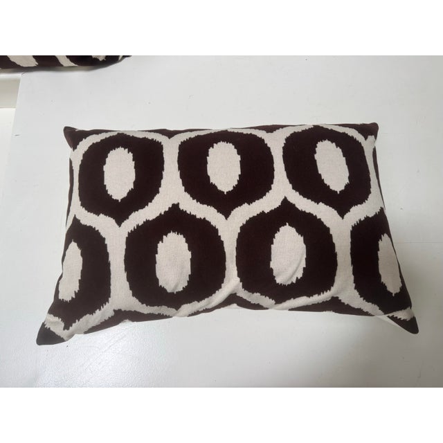 Beautifully made pair of chocolate brown and wheat ikat pillows. Down filled with invisible zippers. Pattern on one side;...