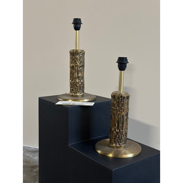 A pair of 'Aurora' table lamps, designed by Luciano Frigerio, Desio, from the 1970s. The stem, featuring an irregular,...