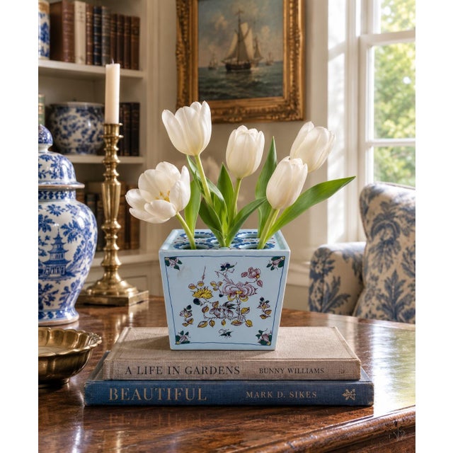 A charming mid-20th-century Dutch Delft porcelain flower frog or tulipiere, fashioned in a compact square form with five...