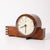 This Art Deco Machine Age electric clock, crafted in burled walnut with rectilinear aluminum banded detailing, is a...