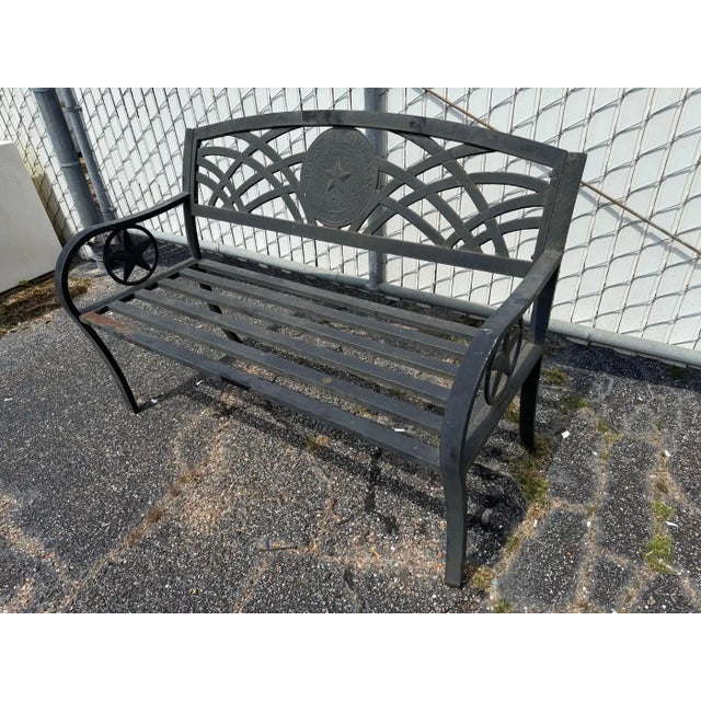 This bench is cast in aluminum. It bears the state seal of Texas on the back. The seat is made of aluminum slats. Height:...