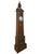 The case is veneered in herringbone parquetry with a central marquetry trophy of musical instruments, ribbons and hanging...