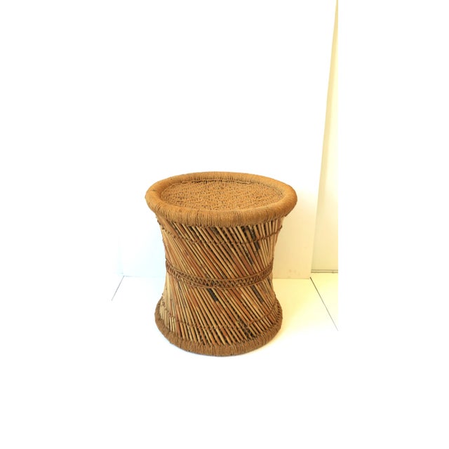 A vintage wicker pencil reed and glass top drinks side table or stool in the Anglo Raj style, circa 20th century, India....