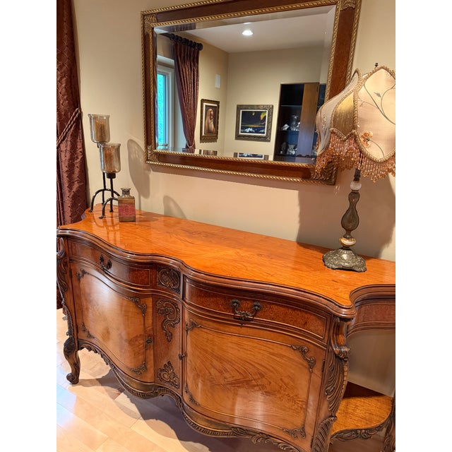 This exquisite Narra wood French Country sideboard was made in 1943. Intricate carvings show the beautiful, detailed...