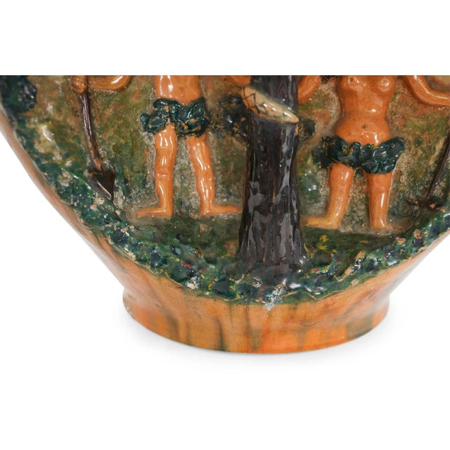 Early 20th century American glazed ceramic decoration jug with a rounded shape depicting Adam & Eve in the Garden of Eden,...