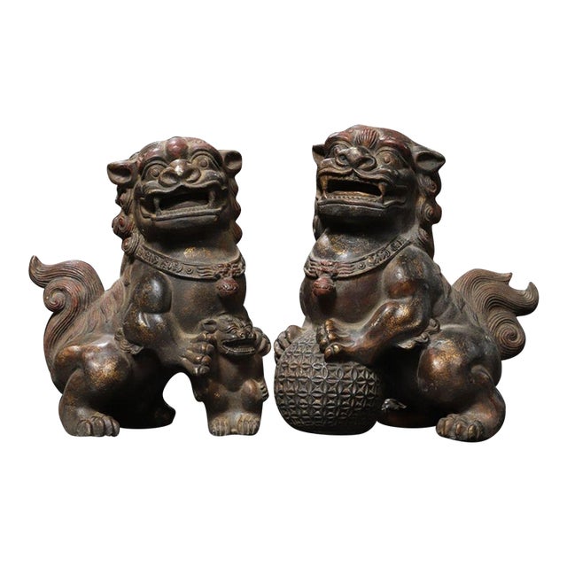 Pair of Vintage Chinese Gilt Bronze Foo Dogs – Buddhist Guardian Lions With Brocade Ball For Sale