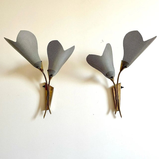 Pair of Italian Mid-Century Modern Sculptural Flower Sconces, Brass, Mesh, 1940s Set of two patinated brass sconces each...