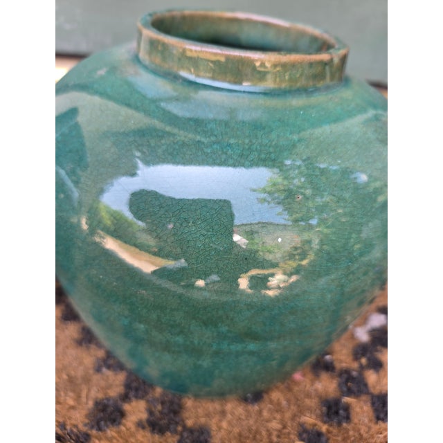 Chinese hand thrown pottery vases. one was originally used for carrying water and pouring liquid. in good condition with...