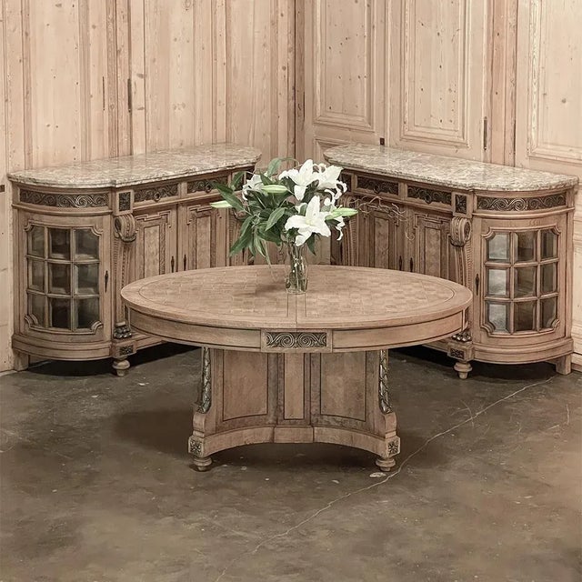 19th Century French Louis XVI Oval Parquet Dining Table with Ormolu is a study in Neoclassical elegance! Utilizing solid...