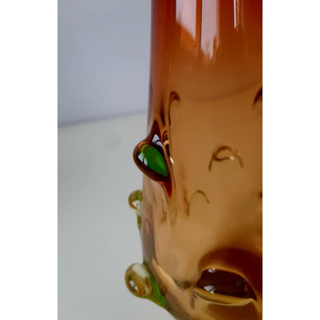 A red, green, and yellow Murano glass vase attributed to Flavio Poli for Seguso Vetri d’Arte, who produced vases with...