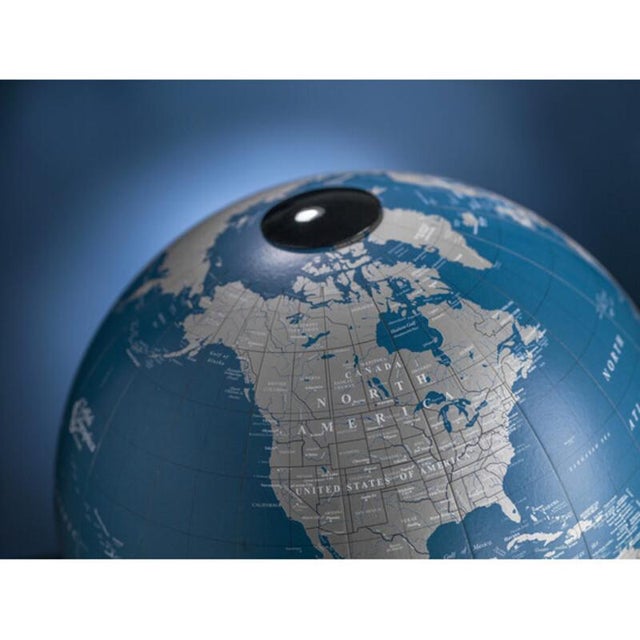 A globe that exudes elegance in its details. The handcrafted Italian beechwood base and the metallic blue sphere create a...