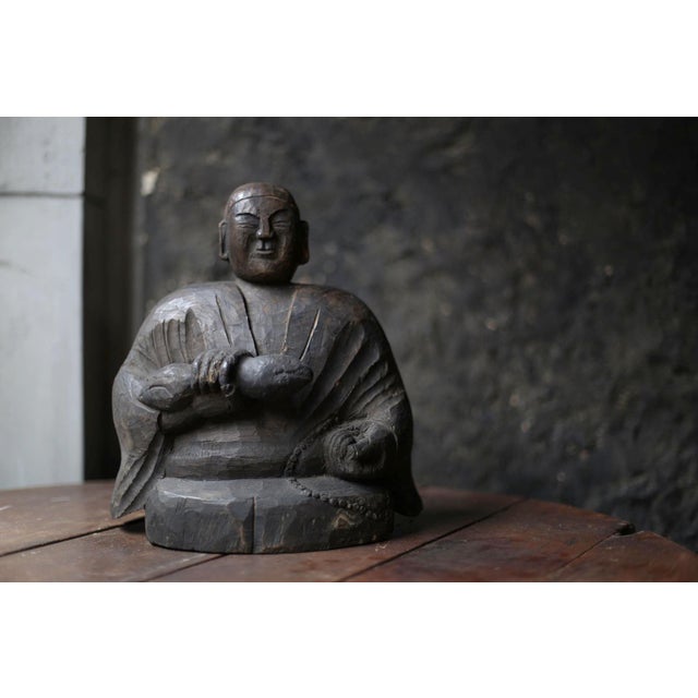 This is an old Japanese "Kobo Daishi" wooden figure. "Kobo Daishi" means "Kukai". "Kukai" was a monk from the early Heian...