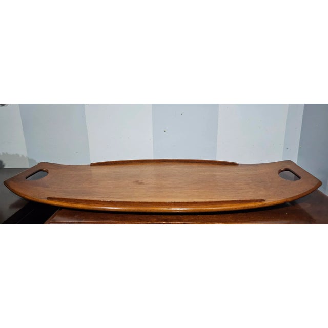 A large 1950s Jens Quistgaard Scandinavian Modern Teak Serving Tray. Measures 26.75" in width, 12.5" in depth and 1.75" in...