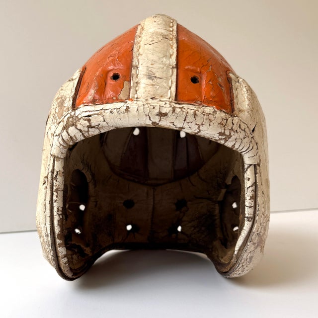 Own a piece of football history with this vintage 1940s MacGregor H612 leather helmet, featuring a classic suspension...