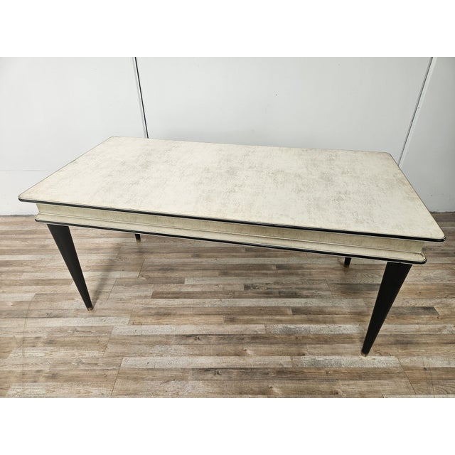 An elegant dining table by Umberto Mascagni, made in Italy in the 1950s, characterized by its unmistakable retro aesthetic...