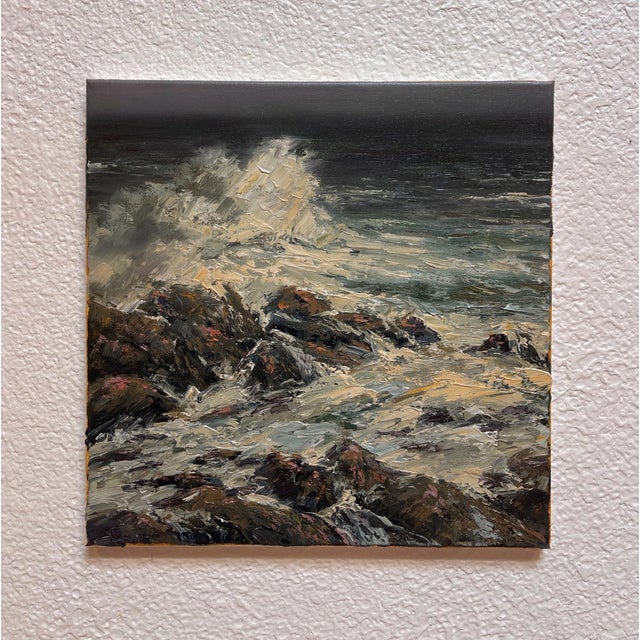 This oil on canvas piece captures the dynamic interplay of waves crashing against rugged rocks along the coast of Cascais,...