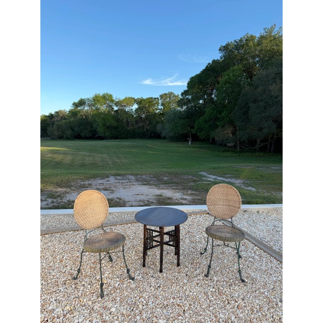 Wonderful 1960s-era carved wood folding base side table with raw steel circular top. A great textural piece for indoor or...