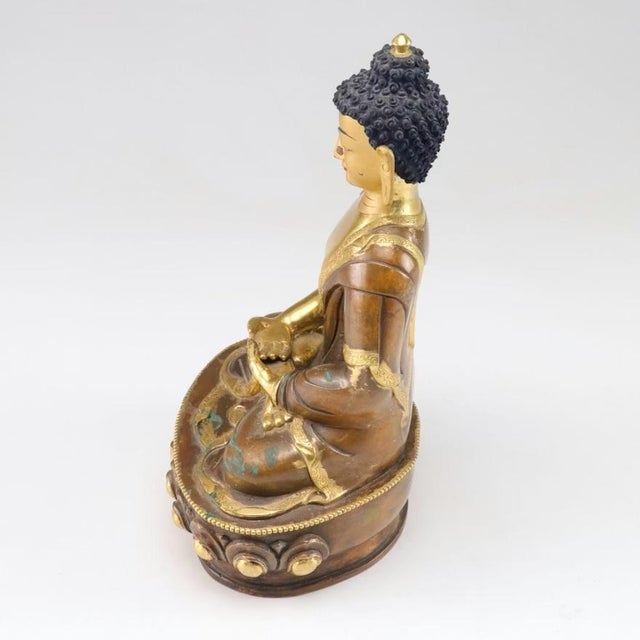 We rarely see gilt copper, but here' one. Everything but the head is covered in 24K gold. Head is gilt painted. Common in...