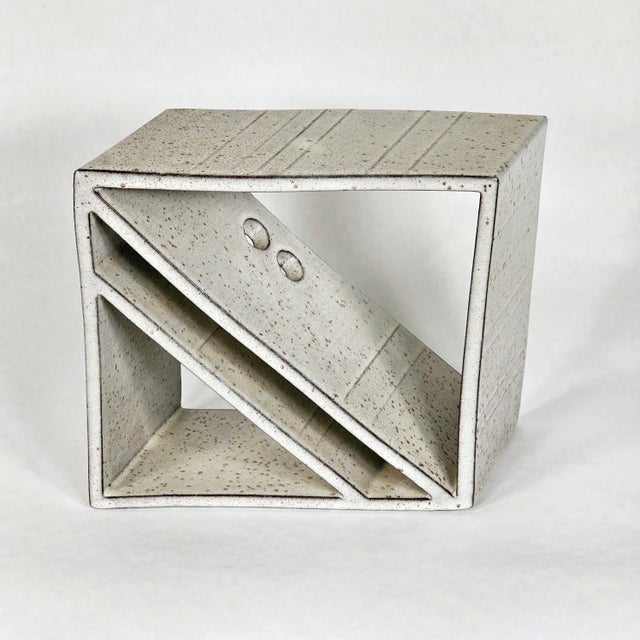 Rare stoneware sculpture in excellent condition. Has a partial label and an incised maker's mark on one corner, as pictured.