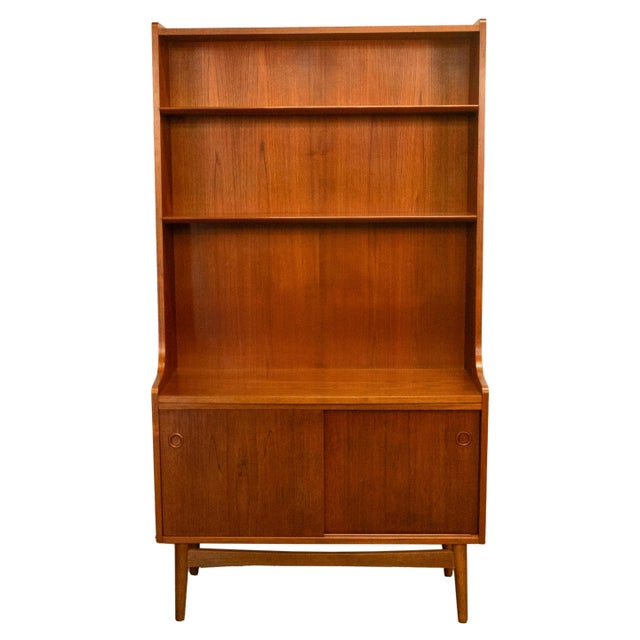 An elegant Danish Mid century Modern teak bookcase room divider designed by Johannes Sorth for Bornholm Møbelfabrik (often...