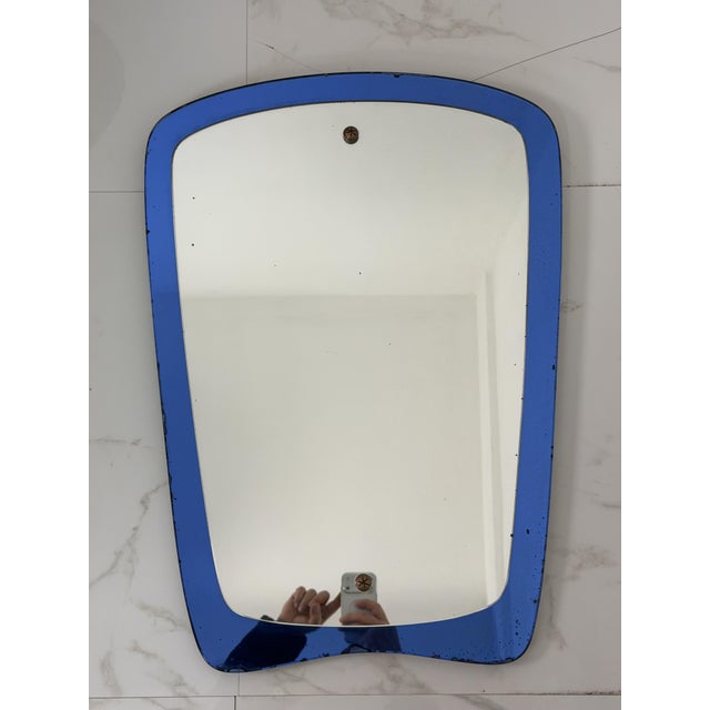 Mid-century colored wall mirror in the style of Cristal Arte, 1960s Overall in good condition, with minor signs of wear,...