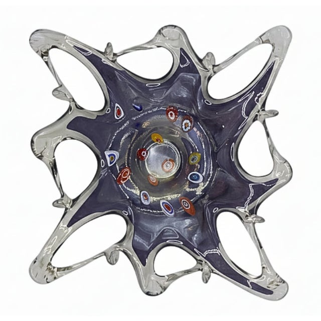 A striking vintage Mid-Century Modern Murano-style art glass dish featuring a sculptural, freeform silhouette in soft...