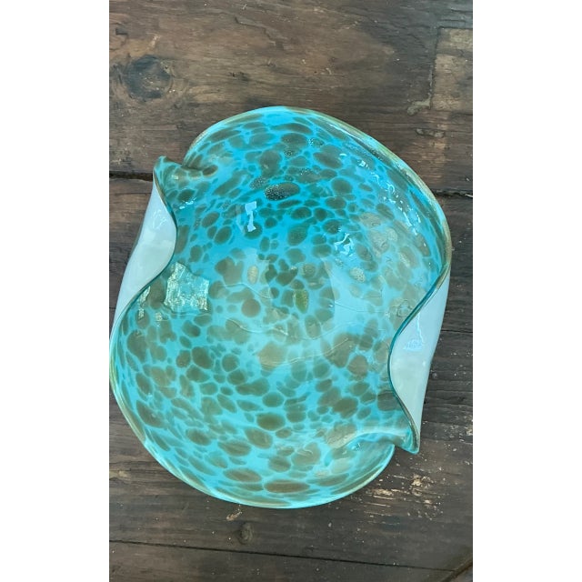 This vintage Italian Murano glass bowl presents a sculptural organic form with a smooth, undulating rim and a vibrant...