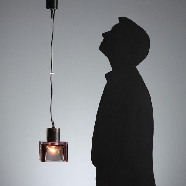 1960s pendant lamp, attributable to the renowned Seguso manufacture, crafted from thick glass. Characterized by an intense...