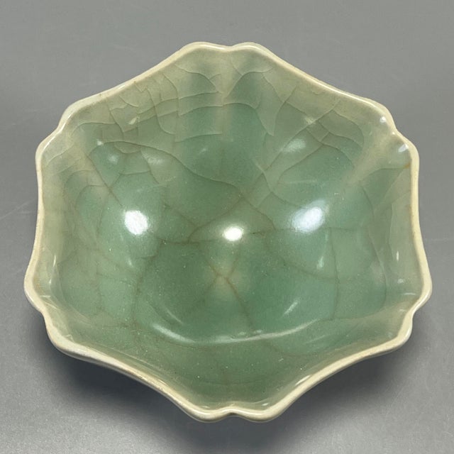 Fine antique Chinese celadon lobed flower‑shaped bowl. Distinct petal‑lobed form, soft pale green crackle‑glaze, elegant...