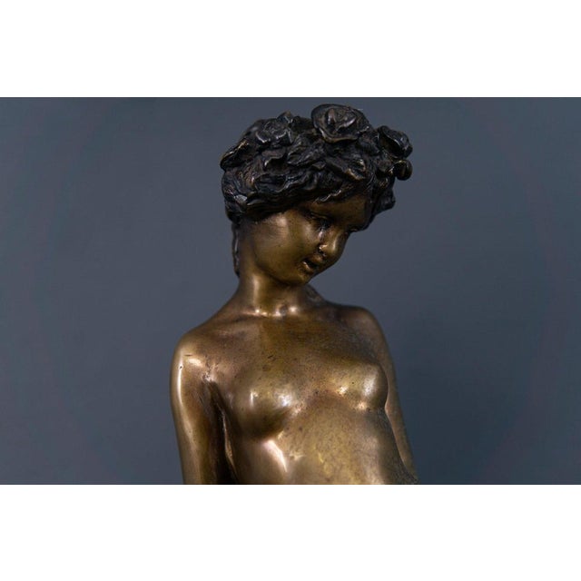 Bronze statue Era & style: probably around 1900 Features - sensual depiction of a young woman sitting elegantly on a rock...