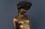 Bronze statue Era & style: probably around 1900 Features - sensual depiction of a young woman sitting elegantly on a rock...